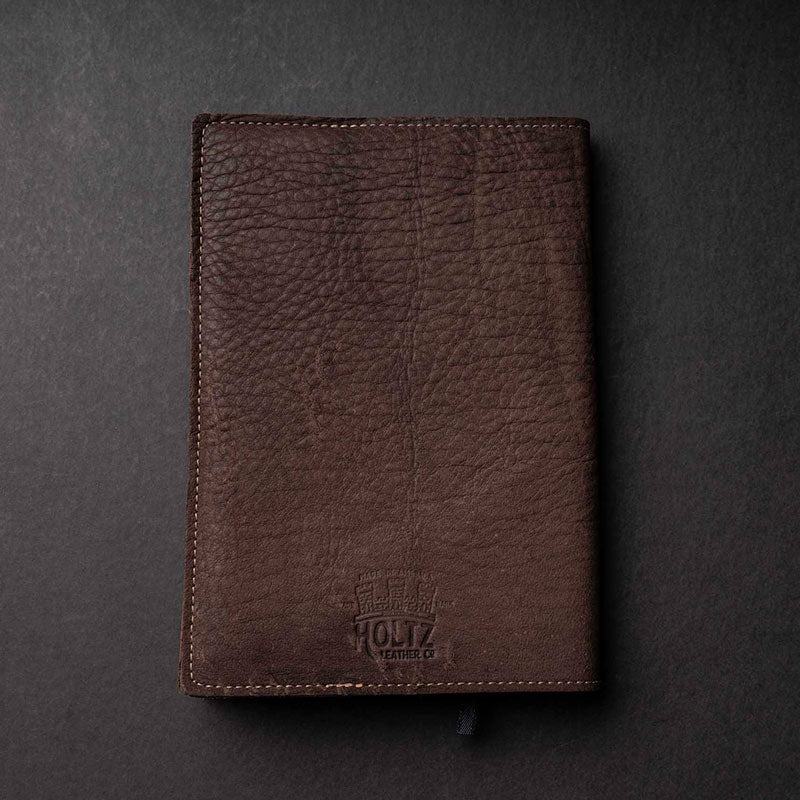 Hand Made Full Grain leather journal cover that comes with a 192 page A5 journal. This journal is handmade and can be personalized with your name or your initials! Made with dark brown shrunken bison leather.