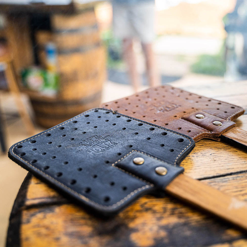 Leather flyswatters in black and brown with wooden handles made of Tennessee Whiskey Barrel